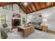 Living area with fireplace, comfortable seating, and natural light at 6129 Krandon Dr, Raleigh, NC 27603