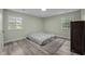 Inviting bedroom with ample natural light, showcasing a comfortable and clean design at 6817 Guess Rd, Hillsborough, NC 27278