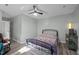 Spacious bedroom with ceiling fan and a cozy rug, creating a relaxing atmosphere at 6817 Guess Rd, Hillsborough, NC 27278