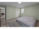 Another view of the bedroom with a closet, bright light, clean design, and modern flooring at 6817 Guess Rd, Hillsborough, NC 27278