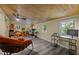 Versatile bonus room with wood ceiling, vinyl floors and lots of natural light at 6817 Guess Rd, Hillsborough, NC 27278