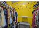 Organized walk-in closet with colorful decorations, storage shelves, and ample hanging space at 6817 Guess Rd, Hillsborough, NC 27278