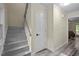 Inviting entryway with wood floors, staircase, and closet, providing a warm welcome into the home at 6817 Guess Rd, Hillsborough, NC 27278