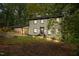Charming two-story home with landscaped front yard and a covered parking area at 6817 Guess Rd, Hillsborough, NC 27278