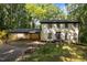 Charming two-story home featuring a covered carport, inviting entrance, and well-manicured lawn at 6817 Guess Rd, Hillsborough, NC 27278