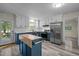 Bright, modern kitchen with two-tone cabinets, stainless steel appliances, and butcher block island at 6817 Guess Rd, Hillsborough, NC 27278
