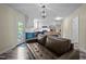 Open eat-in kitchen with painted cabinets, island, and updated stainless steel appliances at 6817 Guess Rd, Hillsborough, NC 27278
