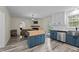 Inviting eat-in kitchen features painted cabinets, kitchen island and updated appliances at 6817 Guess Rd, Hillsborough, NC 27278