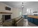 Cozy living room with fireplace, hardwood floors, and lots of natural light at 6817 Guess Rd, Hillsborough, NC 27278