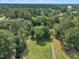 Overhead shot of mature trees, a meticulously maintained lawn, and a quiet, idyllic setting at 705 Wilsons Mills Rd, Smithfield, NC 27577