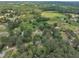 Overhead shot displays a house in a wooded area, illustrating the area's natural setting at 705 Wilsons Mills Rd, Smithfield, NC 27577