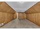 This attic features wood paneled walls and an accessible storage area for your belongings at 705 Wilsons Mills Rd, Smithfield, NC 27577