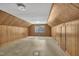 Attic space with wood paneled walls, a window, and linoleum flooring at 705 Wilsons Mills Rd, Smithfield, NC 27577