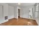 Bedroom with hardwood floors and multiple doors for easy access to other areas at 705 Wilsons Mills Rd, Smithfield, NC 27577