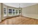 Bright dining room with bay window, chandelier, and hardwood floors at 705 Wilsons Mills Rd, Smithfield, NC 27577