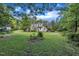 Charming two-story home with mature trees and a sprawling front lawn, perfect for outdoor activities at 705 Wilsons Mills Rd, Smithfield, NC 27577