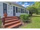 Inviting front entrance with brick steps and charming details at 705 Wilsons Mills Rd, Smithfield, NC 27577