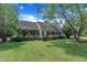Charming single-story home with manicured lawn, lush landscaping, and inviting front porch at 705 Wilsons Mills Rd, Smithfield, NC 27577
