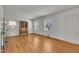 Bright living room with hardwood floors, an antique hutch and natural light from multiple windows at 705 Wilsons Mills Rd, Smithfield, NC 27577