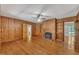 Expansive living room with a fireplace and wood paneled walls at 705 Wilsons Mills Rd, Smithfield, NC 27577