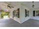 Spacious covered porch featuring ceiling fans, offering a comfortable outdoor living space at 705 Wilsons Mills Rd, Smithfield, NC 27577