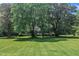 Charming single-story home with well-maintained lawn, mature trees offering privacy at 705 Wilsons Mills Rd, Smithfield, NC 27577