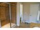 Bathroom featuring tiled walk-in shower with glass door, tile floors, and adjacent toilet with privacy door at 825 Fulworth Ave, Wake Forest, NC 27587
