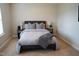Bedroom featuring a comfortable bed, bedside tables, and carpet at 825 Fulworth Ave, Wake Forest, NC 27587
