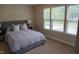Inviting bedroom with a comfortable bed, bedside tables, and lots of natural light from multiple windows at 825 Fulworth Ave, Wake Forest, NC 27587