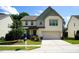 Charming two-story home with a well-manicured lawn, driveway, and an attached garage at 825 Fulworth Ave, Wake Forest, NC 27587