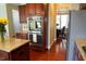 Kitchen featuring granite counters, stainless appliances, wood cabinets and an island at 825 Fulworth Ave, Wake Forest, NC 27587