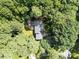 Birds eye view of home and surrounding greenery, showing a well maintained yard and large deck at 8909 Wellsley Way, Raleigh, NC 27613