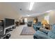 Open basement area featuring a media center, workspace, and relaxing lounge seating arrangement at 8909 Wellsley Way, Raleigh, NC 27613