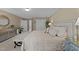 Spacious bedroom with ensuite bathroom and a large, decorative closet door at 8909 Wellsley Way, Raleigh, NC 27613
