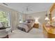 Comfortable bedroom featuring natural light and a cozy sitting area at 8909 Wellsley Way, Raleigh, NC 27613