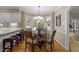 Bright breakfast nook with a round table, bay window, and comfortable seating perfect for casual dining at 8909 Wellsley Way, Raleigh, NC 27613
