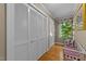 Hallway with closet, bench and view to outdoor space at 8909 Wellsley Way, Raleigh, NC 27613