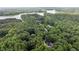 Overhead shot of a secluded home surrounded by greenery, near a lake, highlighting privacy and natural beauty at 901 Tamaras Cir, Wake Forest, NC 27587
