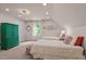 Bedroom with bright green armoire and twin beds decorated with colorful pillows at 901 Tamaras Cir, Wake Forest, NC 27587
