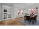 Sophisticated dining room featuring hardwood floors, stylish lighting, and elegant furnishings at 901 Tamaras Cir, Wake Forest, NC 27587