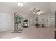 Upstairs gym featuring a treadmill and weight-lifting machine at 901 Tamaras Cir, Wake Forest, NC 27587