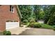 Spacious three car garage nestled among beautiful landscaping on a sprawling private lot at 901 Tamaras Cir, Wake Forest, NC 27587