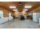 Well-lit garage space, perfect for projects and storage with visible freezer and appliances at 901 Tamaras Cir, Wake Forest, NC 27587
