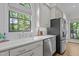 Kitchen detail shows stainless steel appliances and bright counter space at 901 Tamaras Cir, Wake Forest, NC 27587