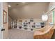 Cozy library features a wall of built-in bookshelves and a reading chair at 901 Tamaras Cir, Wake Forest, NC 27587