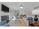 Inviting living room with fireplace, modern decor, and access to outdoor space at 901 Tamaras Cir, Wake Forest, NC 27587