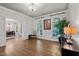 Spacious living room boasts hardwood floors, elegant decor, and large windows for ample light at 901 Tamaras Cir, Wake Forest, NC 27587