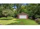 Detached brick outbuilding offering ample storage and workshop space at 901 Tamaras Cir, Wake Forest, NC 27587