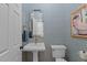 Elegant powder room with diamond patterned wallpaper and gold accents at 901 Tamaras Cir, Wake Forest, NC 27587