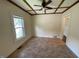 Bedroom featuring neutral walls, a window, and wood trim at 906 Camden Ave, Durham, NC 27701